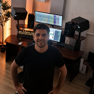 Music producer at a professional studio workstation
